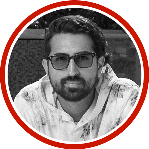 a man named Cyrus Mohseni with glasses and a beard posing for a headshot